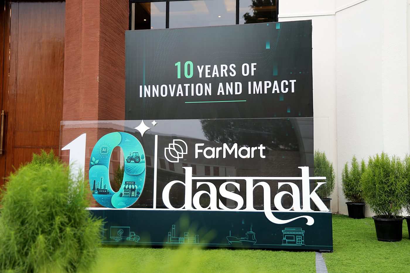 A large standee reading '10 years of innovation and impact', with 3D letters for the illustrated 10 and the dashak wordmark.